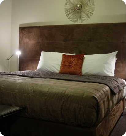Comfortable king bed and elegant suite interior at Terra Vive.